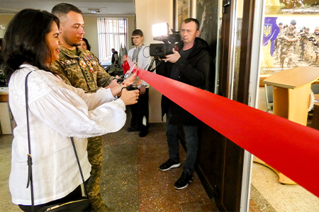 " Dr. Fuentes cuts the ribbon at a ceremony for a new veteran center at Khemelnytskyi Polytechnic College."