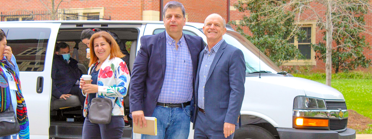 "HECD Program Director Bill Potter posing for a photo with a HECD participant"