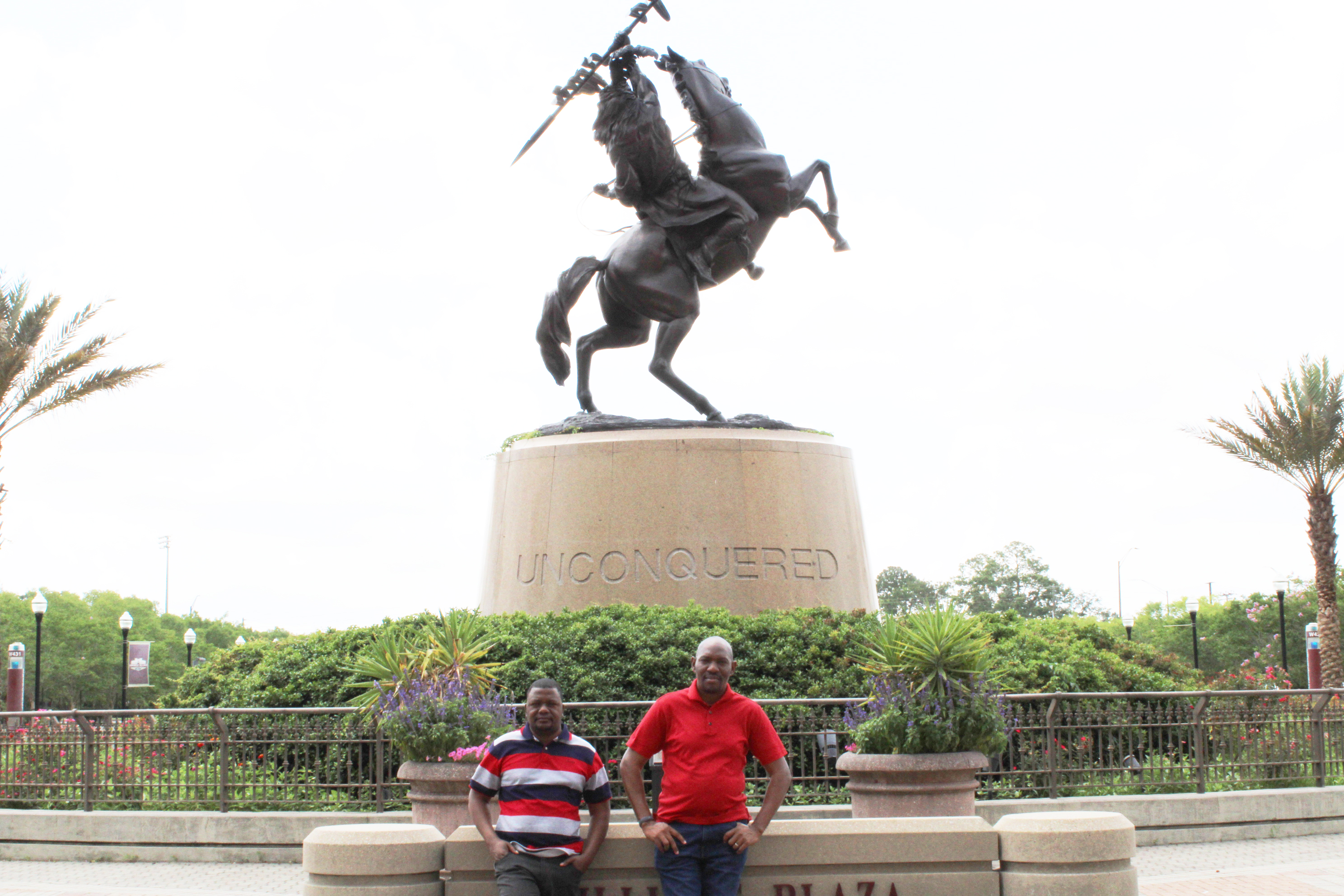 "Handili Jimaima and Joshua Zulu pose at the Unconquered Statue on Langford Green at Florida State University"