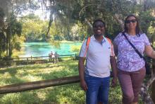 Two people standing in front of a Florida spring