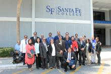 Group photo of the members of the CCAP Egypt delegation posing in front of Santa Fe College building