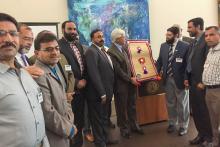 CCAP Pakistan group presenting a gift at Santa Fe COllege