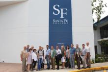 Group photo outside in front of a large Santa Fe College sign