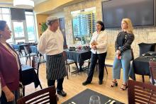 CCAP Mexico members meeting with a chef in a restaurant dining room