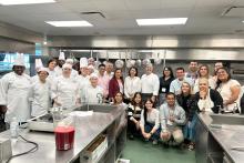CCAP Mexico group photo in a restaurant kitchen with a group of chefs