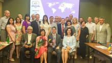 Dr. Fuentes and Dr. Milligan pose for a group photo on a visit to Ukraine in 2018.