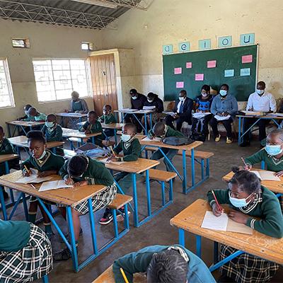 Students working at their desks in a classroom in Zambia. 